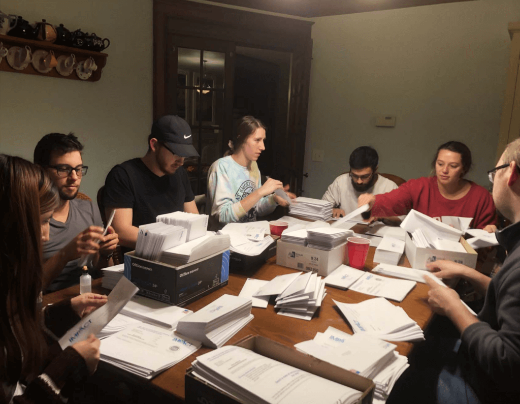 Impact Campus Ministries students working on mailers